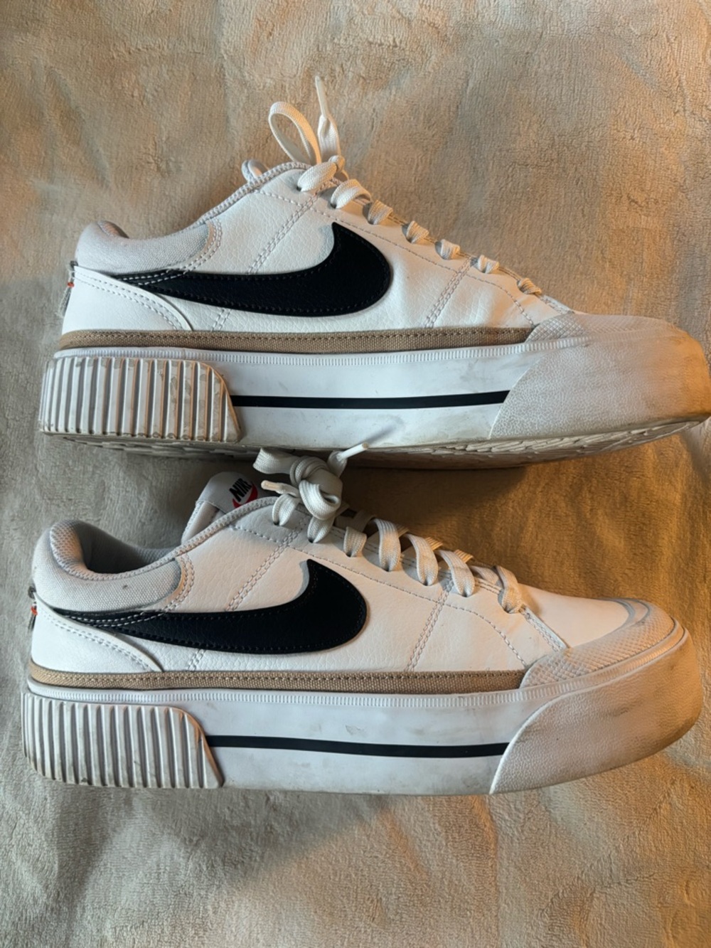 Nike  Women’s White Leather Low-Top Sneakers with Black Swoosh